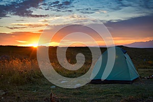 Sunrise over a tourist tent at the Lagonaki plateau